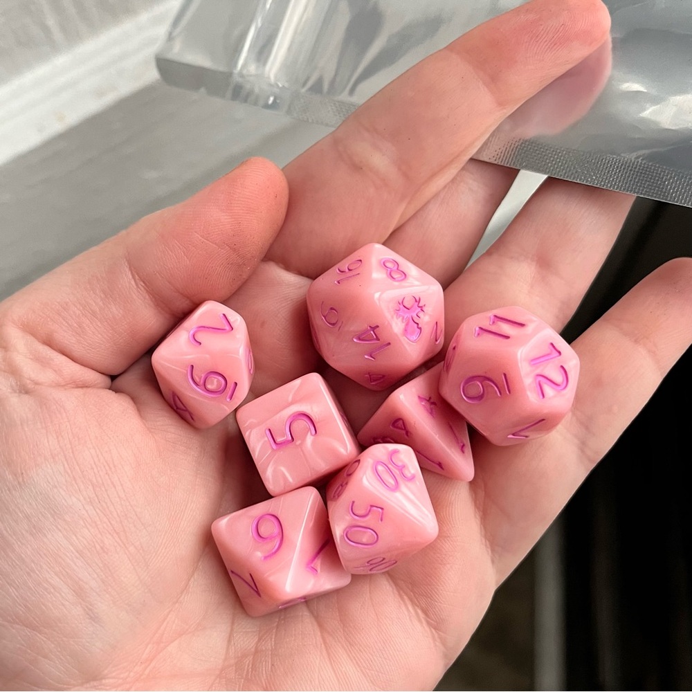 NIB 7-piece pink TTRPG dice set with hot pink ink